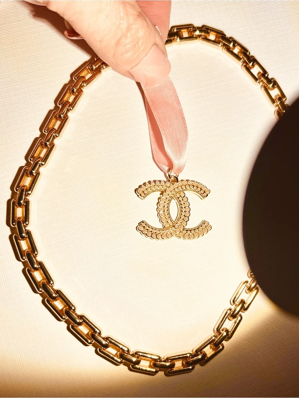 CHANEL Gold CC Pendant with Pink Ribbon New Elegant Chain